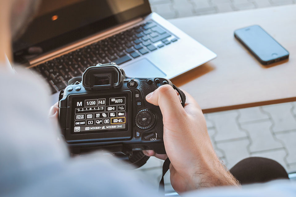 holding camera in hands
