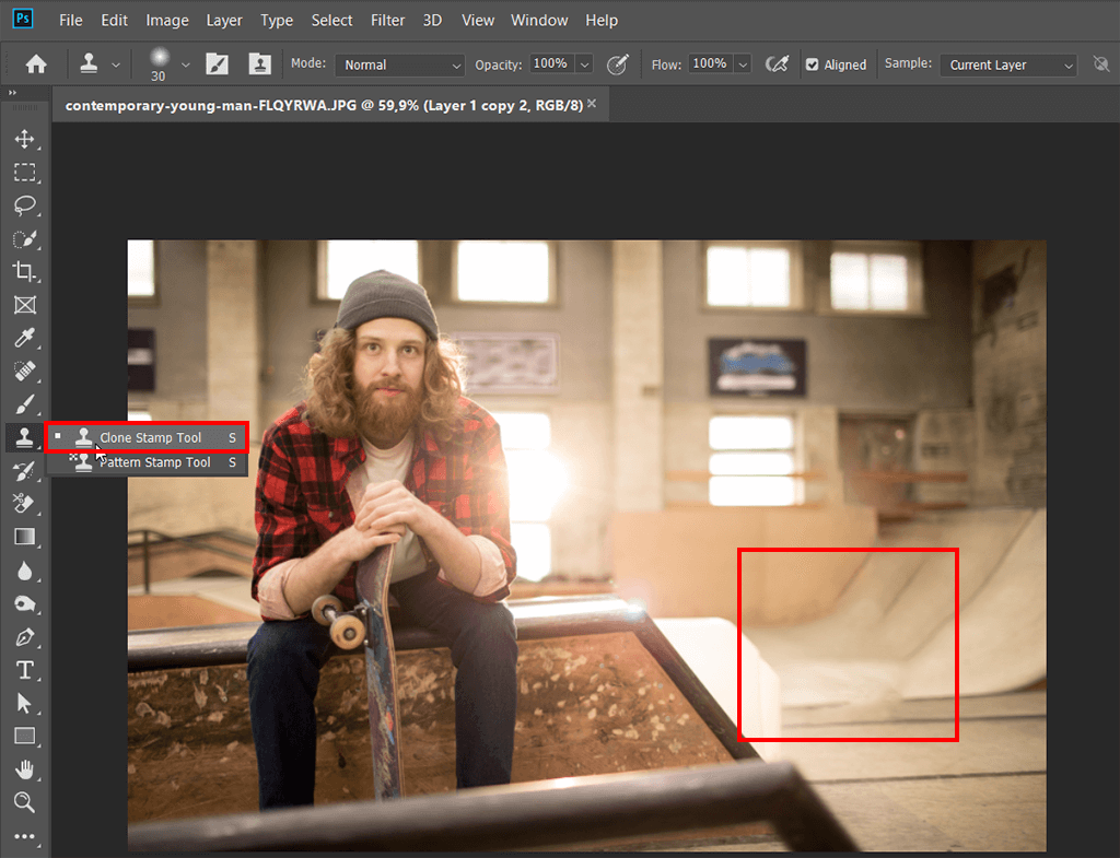 improving the result with the clone stamp tool to remove objects with content aware fill